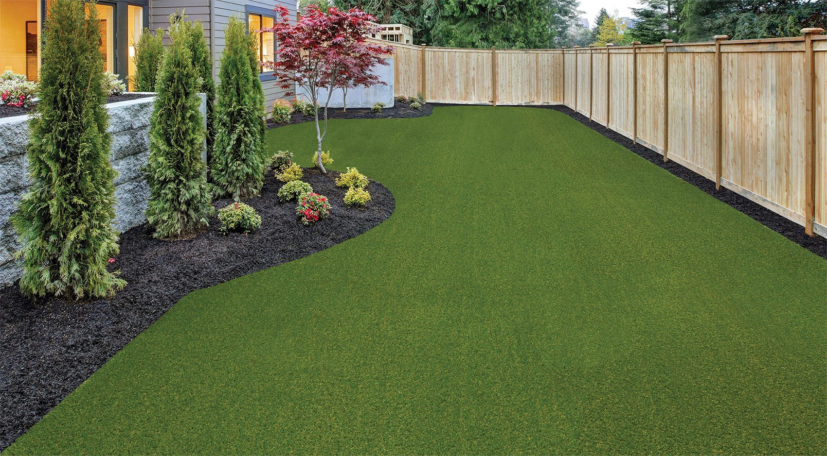 turf-georgian-landscape-design Example of artificial turf on a home lawn by Georgia Landscape Design